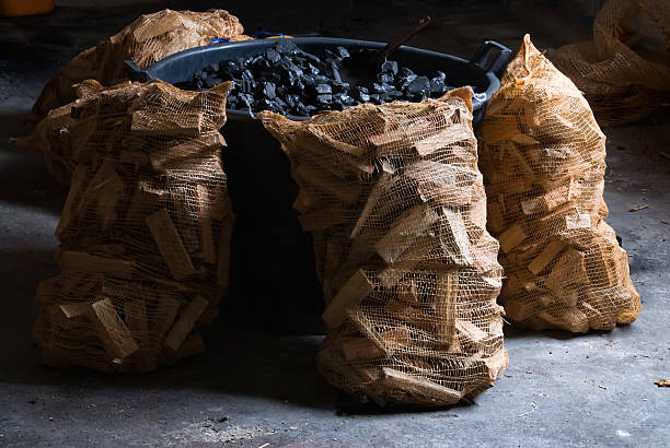 Premium hardwood charcoal stored in dry, sealed bags.